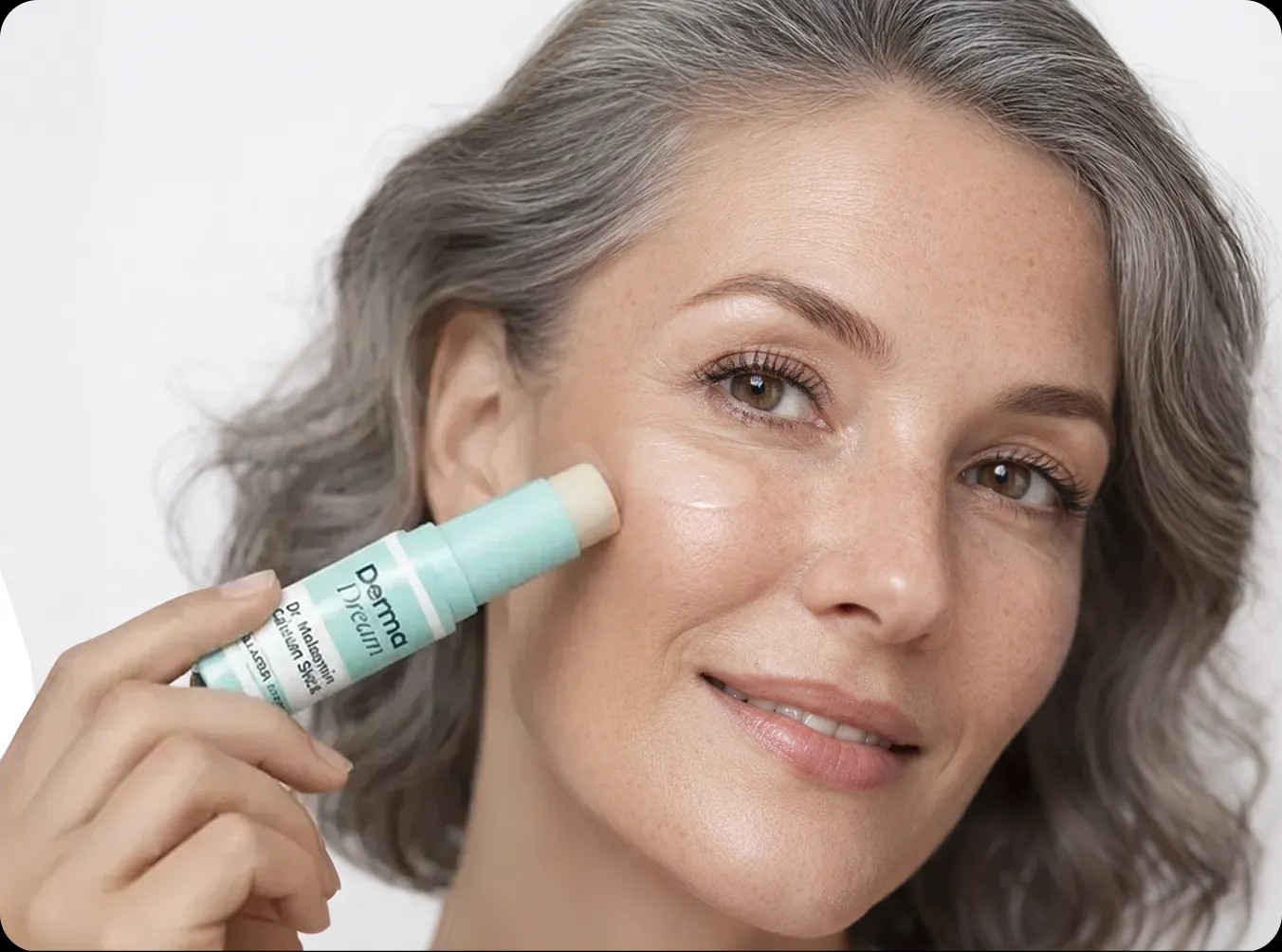 Dr. Melasmin Calcium Stick being applied beneath the eye
